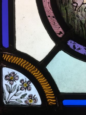 Stained glass panel with hares.