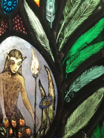 Small stained glass panel with nature spirit.