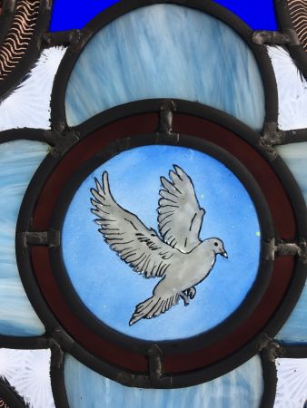 Victorian style stained glass panel with dove.