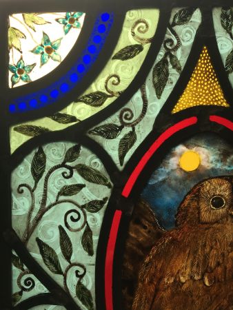 Stained glass panel with owl.