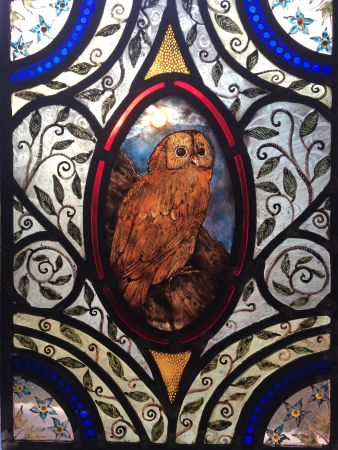 Stained glass panel with owl.