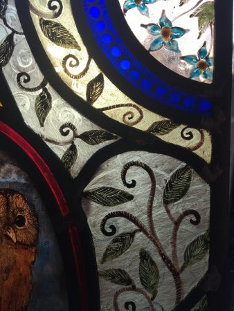 Stained glass panel with owl.