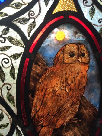 Stained glass panel with owl.