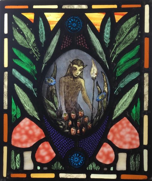 Small stained glass panel with nature spirit.